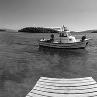 nydri-beach-from-wooden-quay-in-summer-lefkada-greece